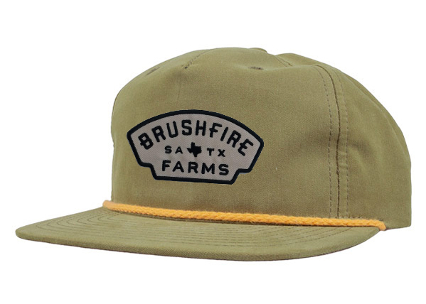 Olive rope hat featuring a silver Brushfire Farms Texas patch, perfect for outdoor enthusiasts and fans of Texas products.