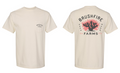 Cream shirt featuring a cactus logo and "Brushfire Farms" text on the back, with a pocket design on the front.