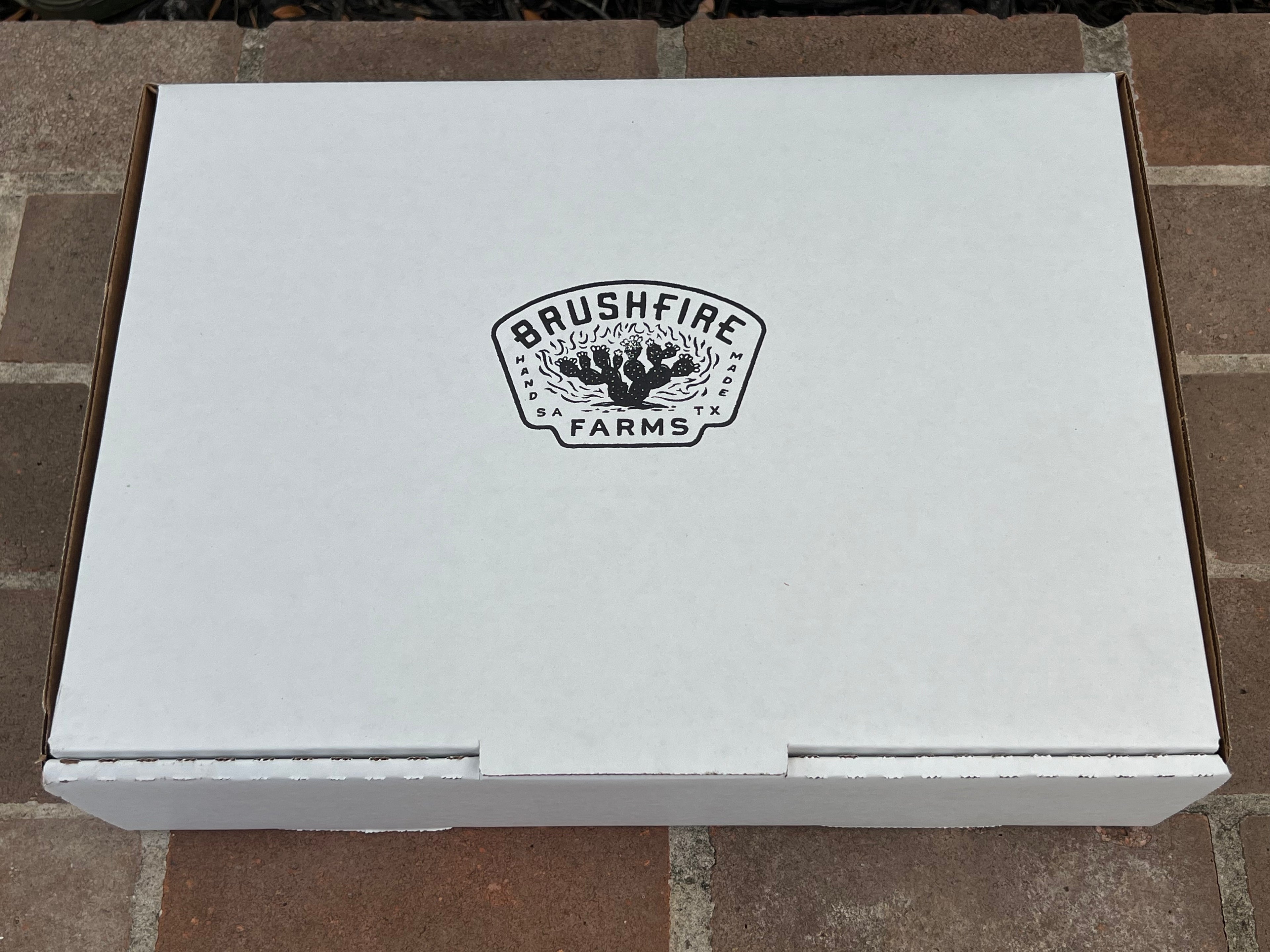 White box featuring the Brushfire Farms logo, designed for packaging the El Jefe product.