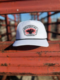 White Brushfire Cap America rope hat featuring an embroidered logo with a vibrant design, perfect for outdoor enthusiasts.