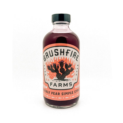 Prickly Pear Simple Syrup in a glass bottle with a vibrant label featuring cacti and Brushfire Farms branding.