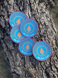Brightly colored Brushfire Farms sticker featuring a flame design, showcasing the brand name and location, San Antonio, Texas.